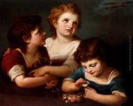 I bambini con un nido di uccelli e fiori I bambini con un nido di uccelli e fiori