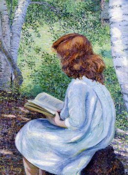 Bambino con la lettura capelli rossi Bambino con la lettura capelli rossi