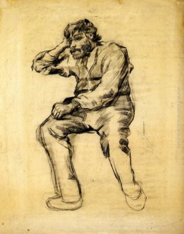 L'uomo seduto con una barba L'uomo seduto con una barba