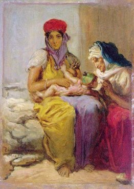 Giovane moresco donna che allatta il suo bambino Giovane moresco donna che allatta il suo bambino