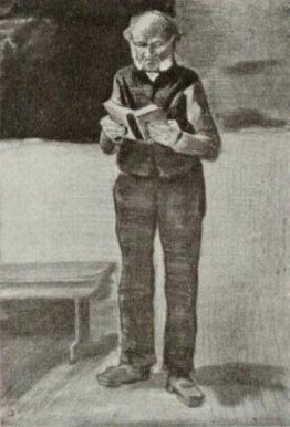 L'uomo, in piedi, che legge un libro