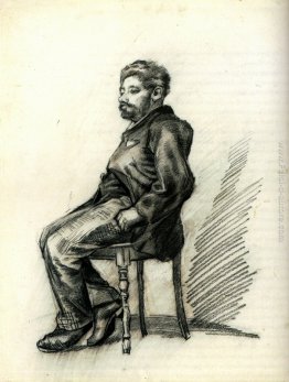 L'uomo seduto con una barba