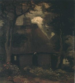Cottage con alberi e contadina