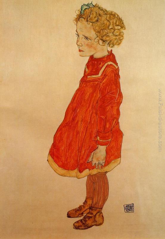 Bambina con capelli biondi in un vestito rosso
